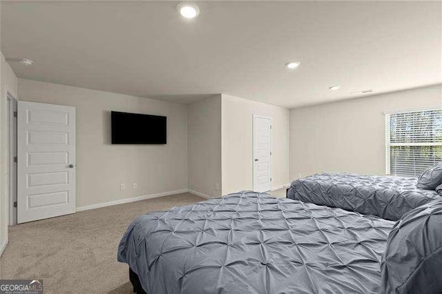 bedroom featuring baseboards, recessed lighting, and carpet