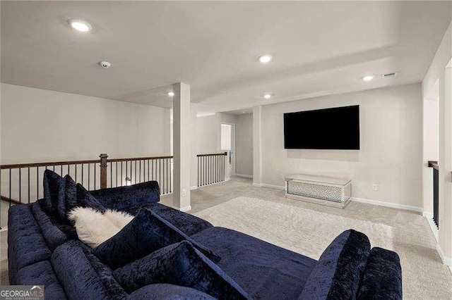 carpeted living room featuring baseboards and recessed lighting