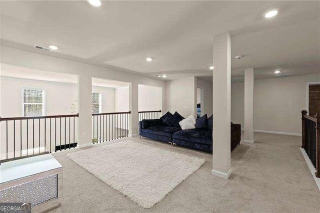 interior space featuring recessed lighting, baseboards, visible vents, and carpet floors