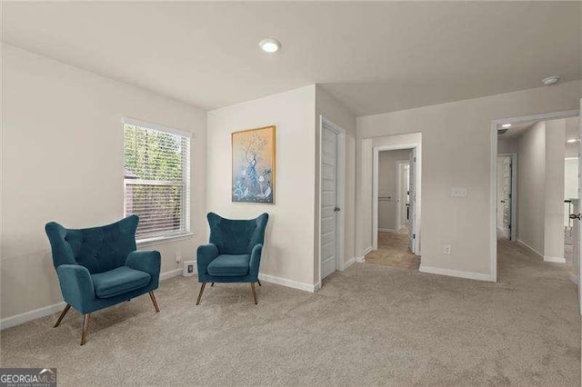sitting room with carpet flooring and baseboards