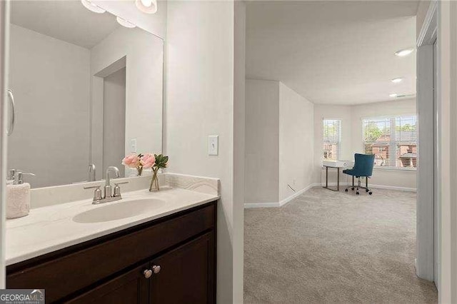 bathroom featuring vanity and baseboards