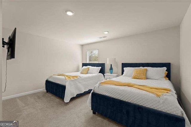bedroom featuring visible vents, baseboards, and carpet floors