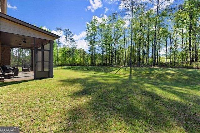 view of yard featuring a sunroom