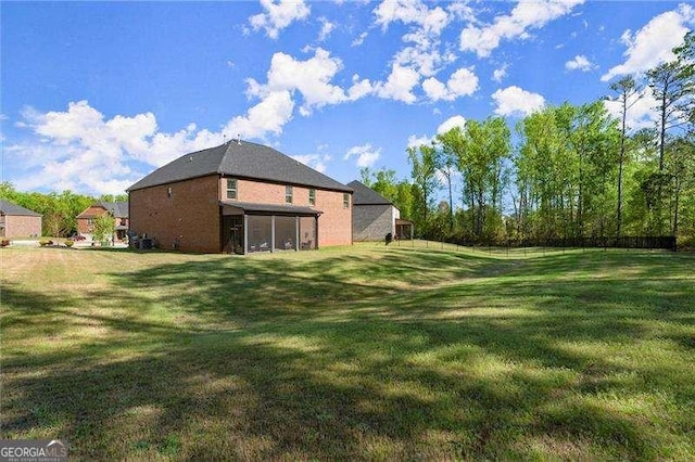 view of yard with a sunroom