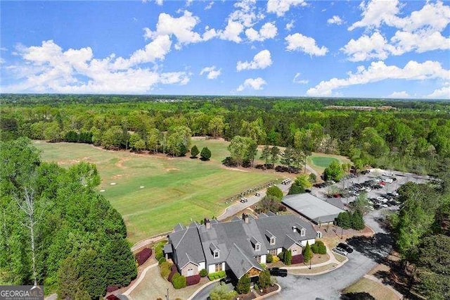 drone / aerial view featuring a view of trees