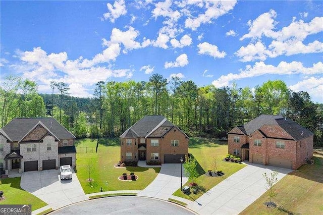 drone / aerial view with a wooded view