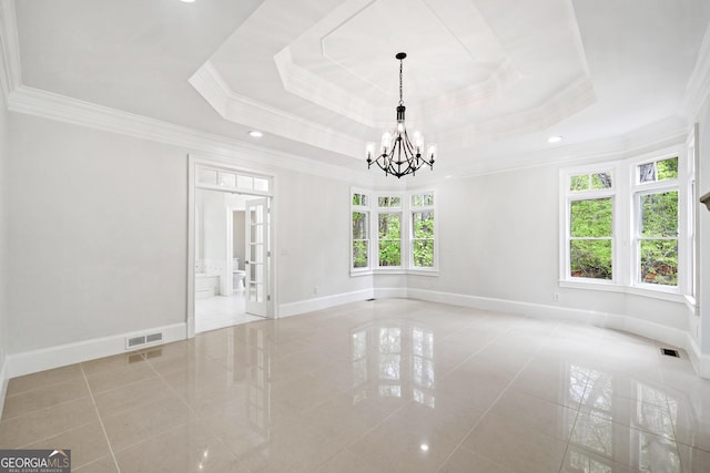empty room with tile patterned floors, a notable chandelier, baseboards, and visible vents