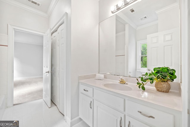 full bathroom featuring vanity, ornamental molding, and visible vents