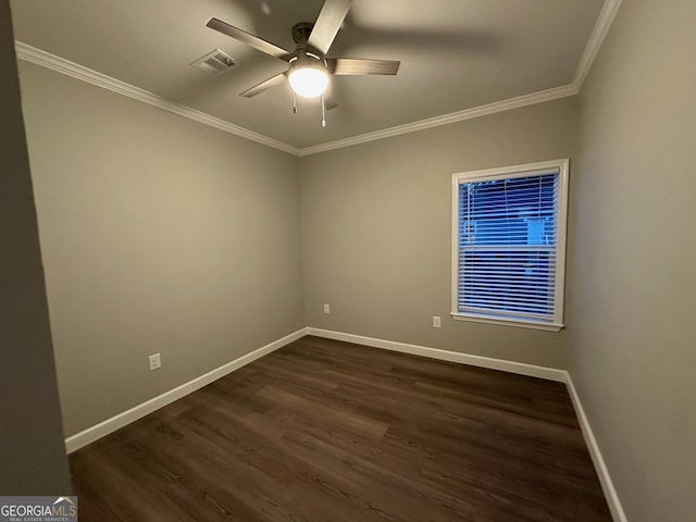 16 Pear St, Ludowici, GA 31316 - spare room with ornamental molding, a ceiling fan, visible vents, baseboards, and dark wood-style floors
