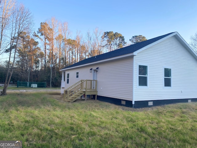 16 Pear St, Ludowici, GA 31316 - back of house featuring a lawn