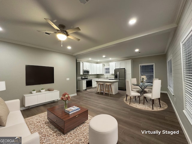 16 Pear St, Ludowici, GA 31316 - living room with a ceiling fan, dark wood-style flooring, ornamental molding, and recessed lighting