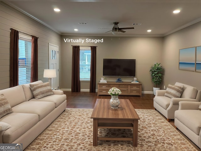 16 Pear St, Ludowici, GA 31316 - living room featuring wood finished floors, ceiling fan, ornamental molding, and visible vents