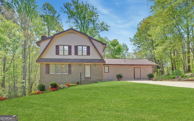 186 Foxdale Dr, Toccoa, GA 30577 - view of front of house with brick siding, a chimney, a gambrel roof, and a front yard