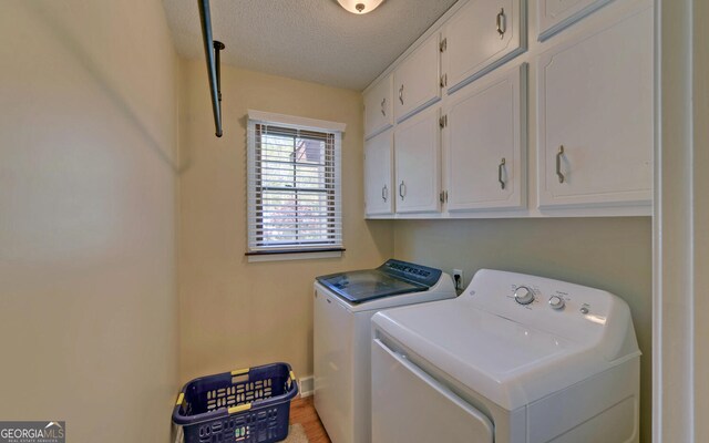 186 Foxdale Dr, Toccoa, GA 30577 - washroom featuring a textured ceiling, cabinet space, and washing machine and clothes dryer