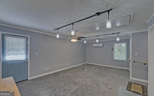 186 Foxdale Dr, Toccoa, GA 30577 - carpeted spare room featuring crown molding, attic access, a wall mounted AC, rail lighting, and a ceiling fan