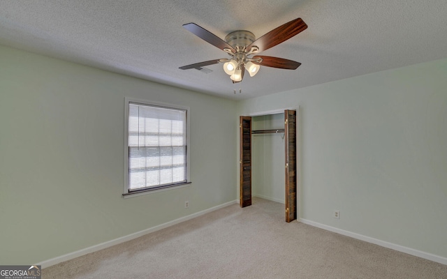 186 Foxdale Dr, Toccoa, GA 30577 - unfurnished bedroom with carpet floors, a textured ceiling, and a closet