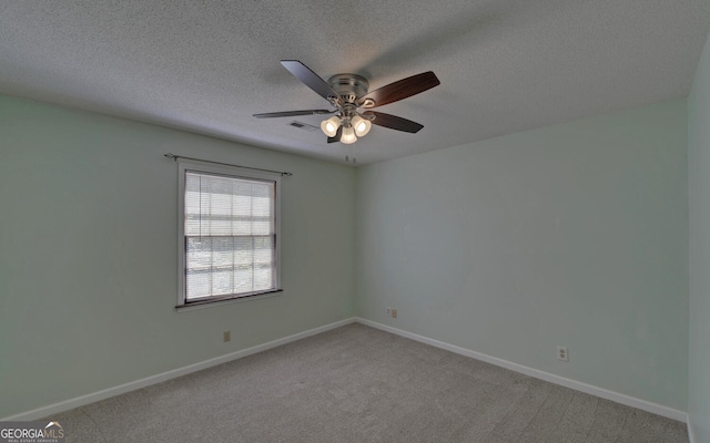 186 Foxdale Dr, Toccoa, GA 30577 - unfurnished room with light colored carpet, a ceiling fan, a textured ceiling, and baseboards