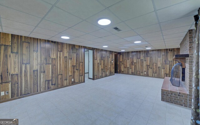 186 Foxdale Dr, Toccoa, GA 30577 - finished below grade area featuring wood walls, a drop ceiling, and visible vents