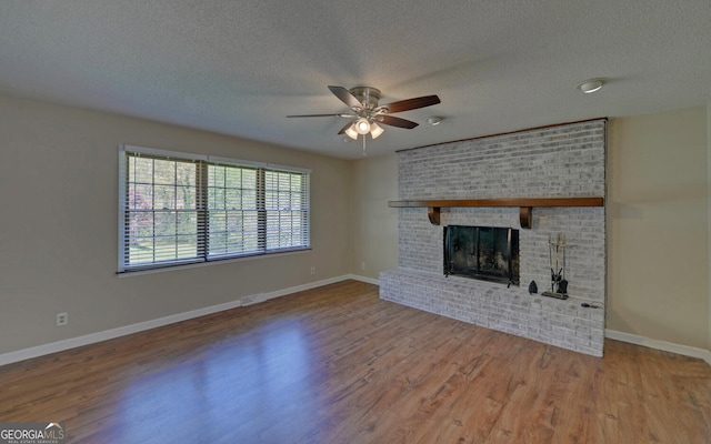 186 Foxdale Dr, Toccoa, GA 30577 - unfurnished living room with a textured ceiling, ceiling fan, baseboards, and wood finished floors