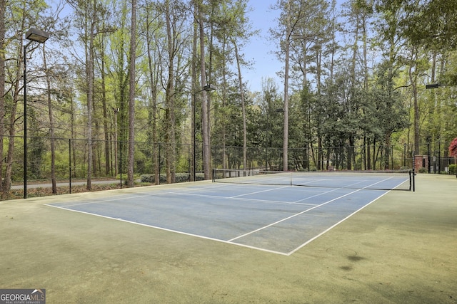 view of sport court featuring fence and community basketball court