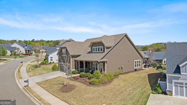347 Woodridge Pass, Canton, GA 30114 - view of front of house featuring driveway, a residential view, a front lawn, and roof with shingles