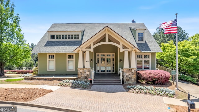 347 Woodridge Pass, Canton, GA 30114 - craftsman-style house with french doors, a porch, roof with shingles, and stone siding