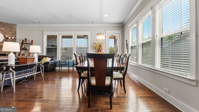 347 Woodridge Pass, Canton, GA 30114 - dining room featuring healthy amount of natural light, crown molding, and dark wood-style floors