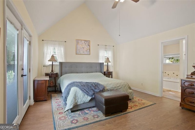 19 Mccrary Ct, Ellijay, GA 30536 - bedroom with high vaulted ceiling, light wood-style flooring, a ceiling fan, and ensuite bathroom