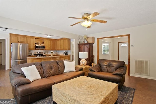 19 Mccrary Ct, Ellijay, GA 30536 - living room featuring visible vents, ceiling fan, baseboards, and dark wood-style floors