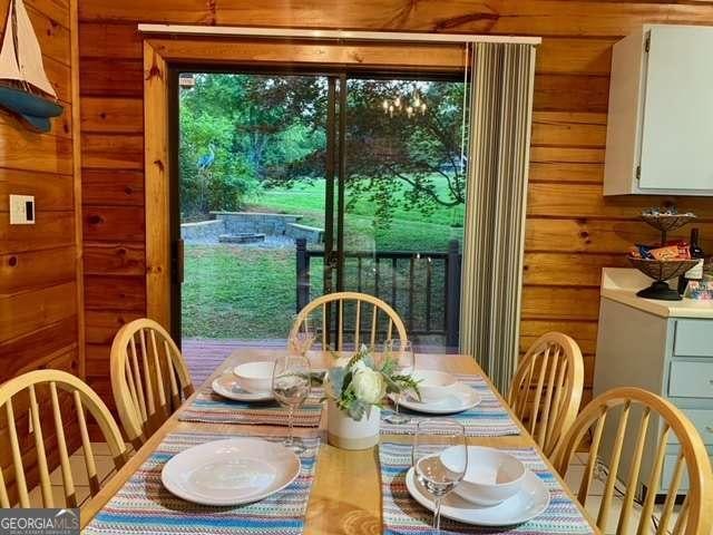 2209 Bell View Ln, Young Harris, GA 30582 - dining space with wooden walls and plenty of natural light