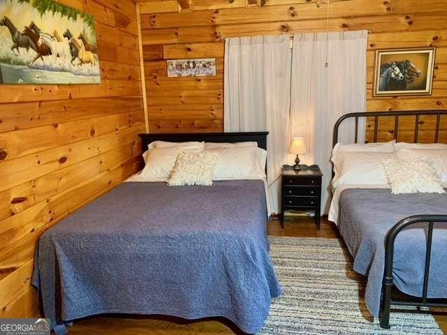 2209 Bell View Ln, Young Harris, GA 30582 - bedroom featuring wooden walls