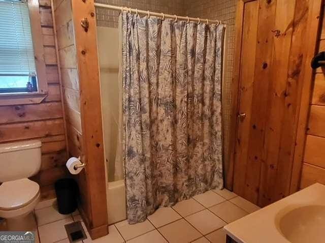 2209 Bell View Ln, Young Harris, GA 30582 - bathroom with shower / bath combination with curtain, tile patterned floors, vanity, and toilet