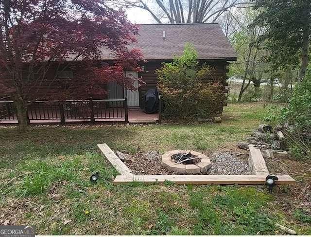2209 Bell View Ln, Young Harris, GA 30582 - view of yard with a wooden deck and an outdoor fire pit