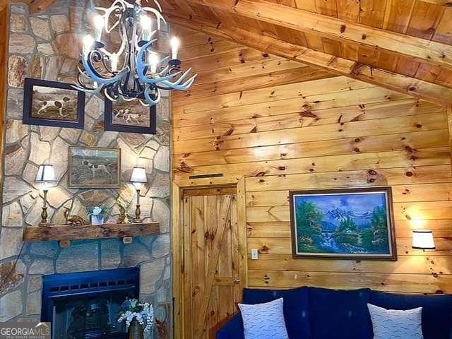 2209 Bell View Ln, Young Harris, GA 30582 - unfurnished room featuring wood ceiling, wood walls, beam ceiling, and a notable chandelier