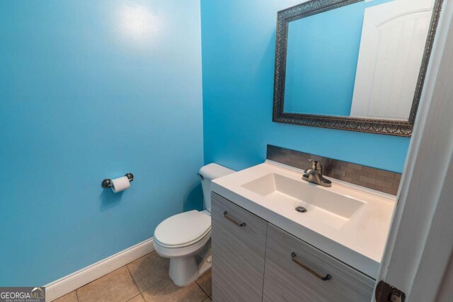 170 Shoal Park Dr, Mcdonough, GA 30252 - half bathroom with toilet, tile patterned floors, vanity, and baseboards
