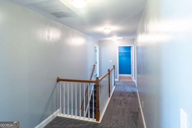 170 Shoal Park Dr, Mcdonough, GA 30252 - hallway with visible vents, baseboards, carpet flooring, and an upstairs landing