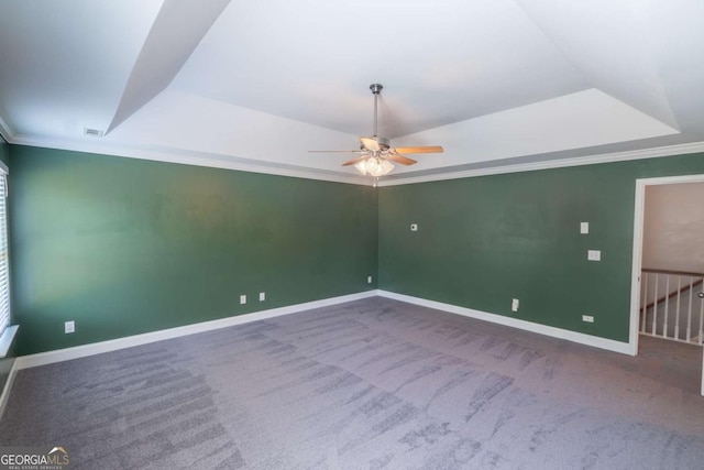 170 Shoal Park Dr, Mcdonough, GA 30252 - carpeted spare room with baseboards, a tray ceiling, a ceiling fan, and crown molding