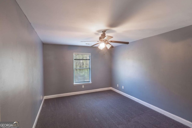 170 Shoal Park Dr, Mcdonough, GA 30252 - spare room with baseboards, a ceiling fan, and dark colored carpet