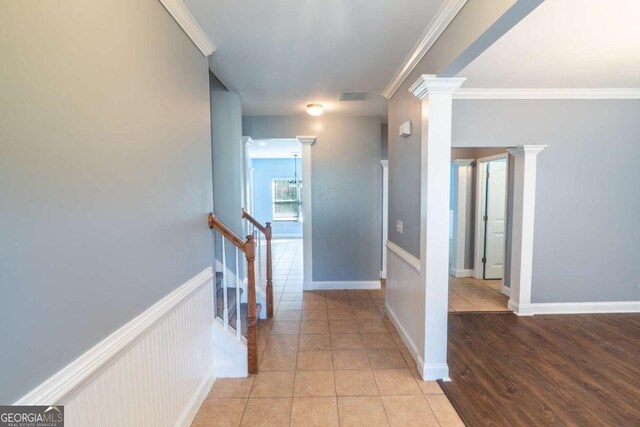 170 Shoal Park Dr, Mcdonough, GA 30252 - hall with wainscoting, light tile patterned floors, ornamental molding, and an upstairs landing
