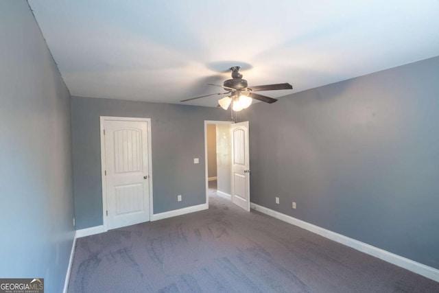 170 Shoal Park Dr, Mcdonough, GA 30252 - unfurnished bedroom featuring baseboards, a ceiling fan, and carpet flooring