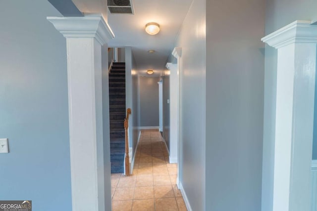 170 Shoal Park Dr, Mcdonough, GA 30252 - hallway with visible vents, baseboards, light tile patterned floors, decorative columns, and stairs