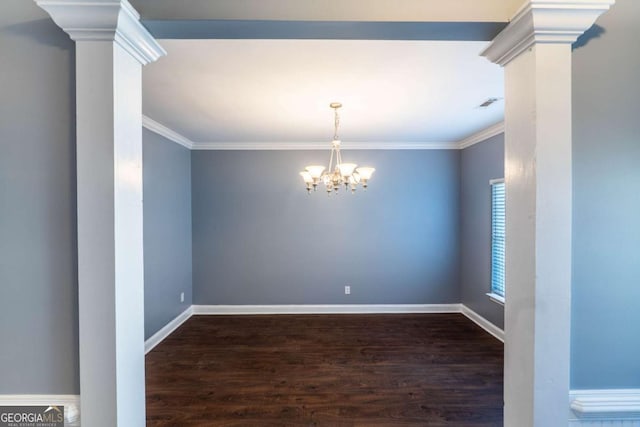 170 Shoal Park Dr, Mcdonough, GA 30252 - spare room with ornamental molding, a notable chandelier, dark wood-style floors, and baseboards