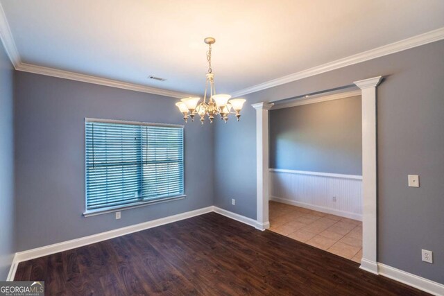 170 Shoal Park Dr, Mcdonough, GA 30252 - unfurnished room featuring ornamental molding, a wainscoted wall, an inviting chandelier, and wood finished floors