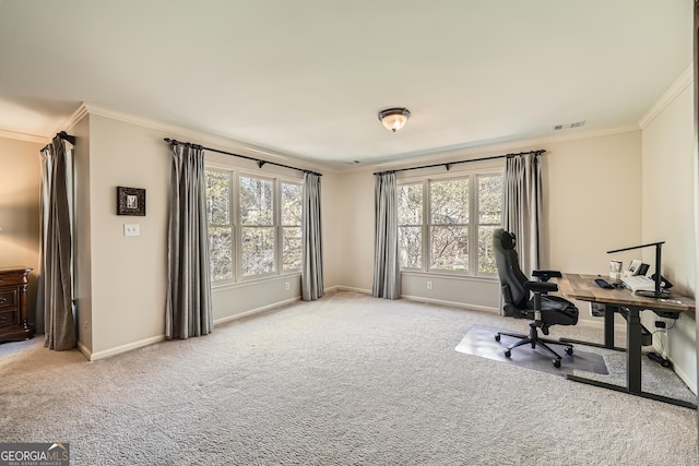 home office with carpet flooring, baseboards, ornamental molding, and visible vents