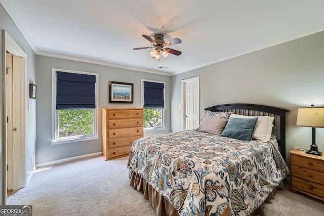 bedroom featuring carpet flooring, baseboards, ornamental molding, and a ceiling fan