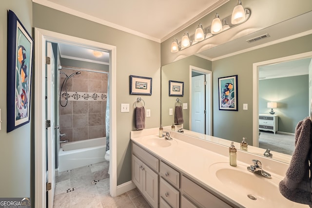 full bath with double vanity, a sink, ornamental molding, and visible vents