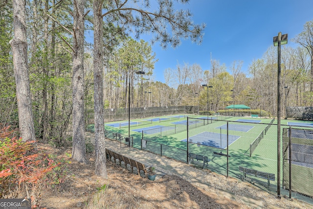 view of tennis court with fence