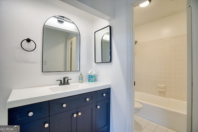 full bathroom with toilet, tile patterned floors,  shower combination, and vanity