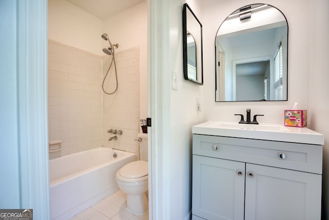bathroom featuring tile patterned flooring, shower / tub combination, toilet, and vanity