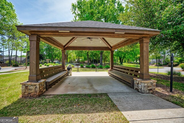 surrounding community featuring a lawn, a gazebo, fence, and a patio area
